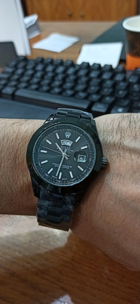 Rolex gün ve tarih göstergeli çelik kasa kordon pilli kol saati